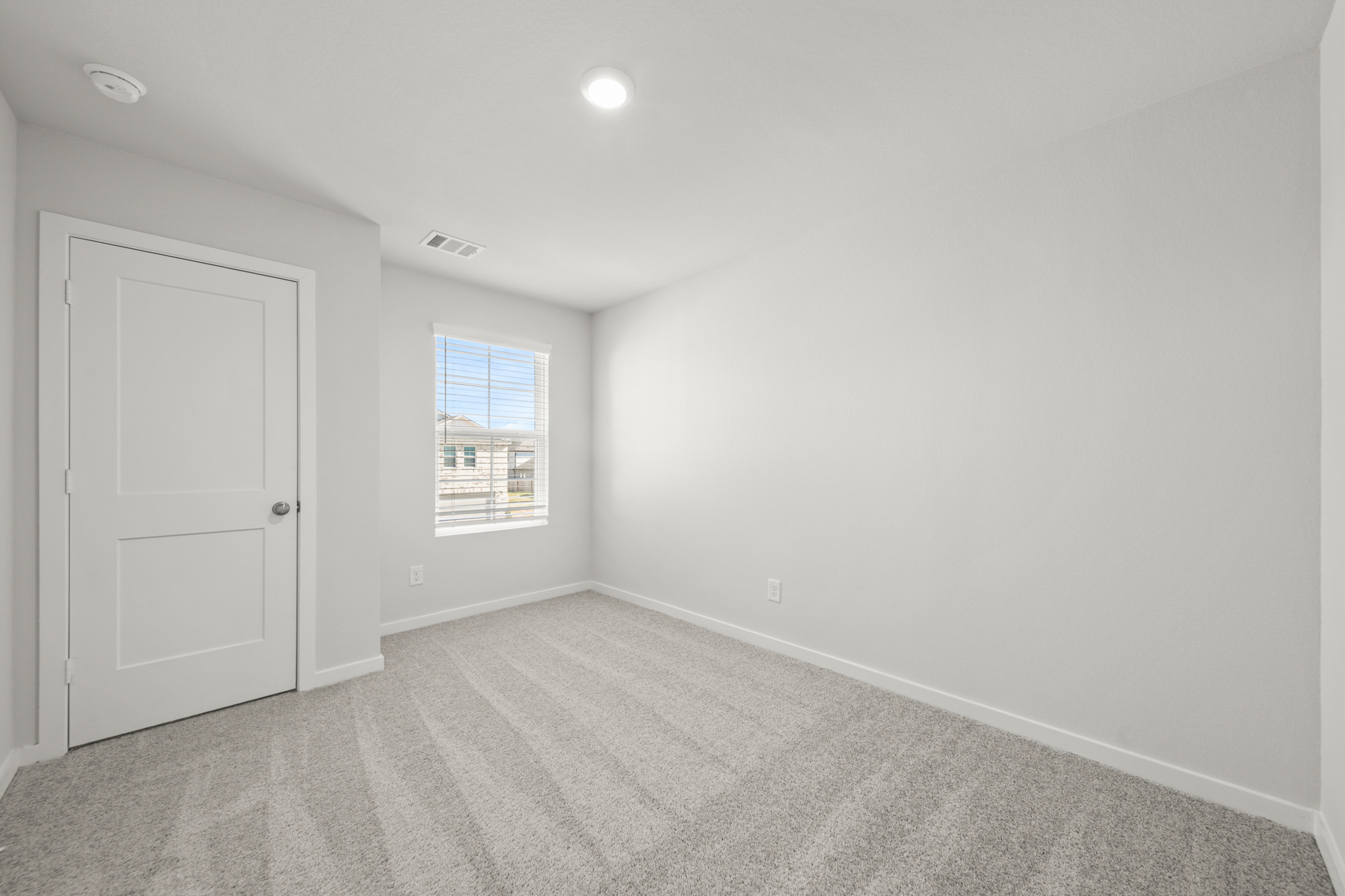 A room with a door and a window.