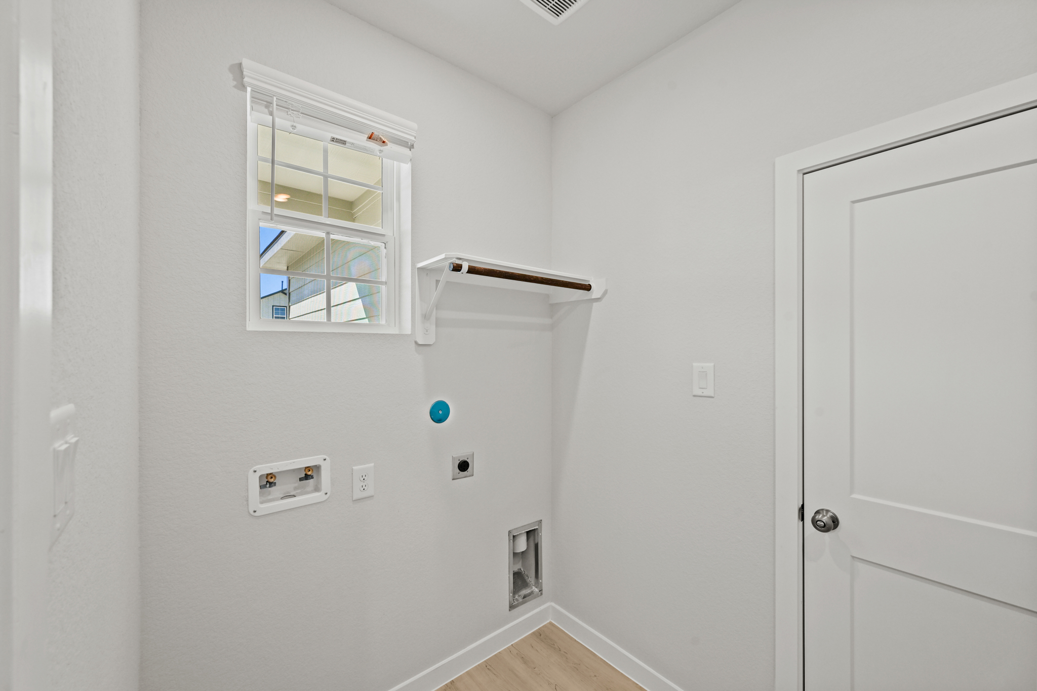 A room with a window and a door.