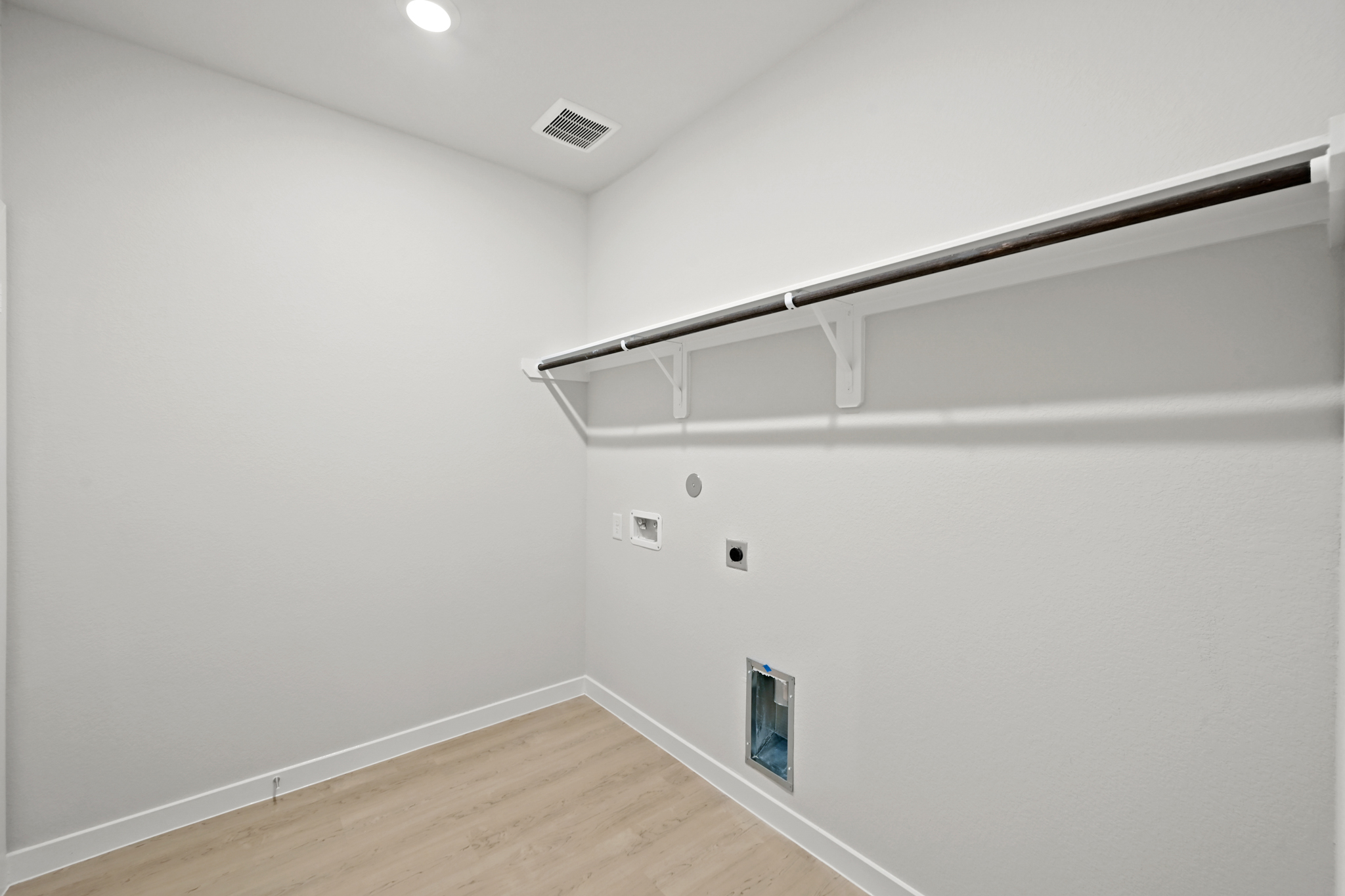 A white wall with a light.