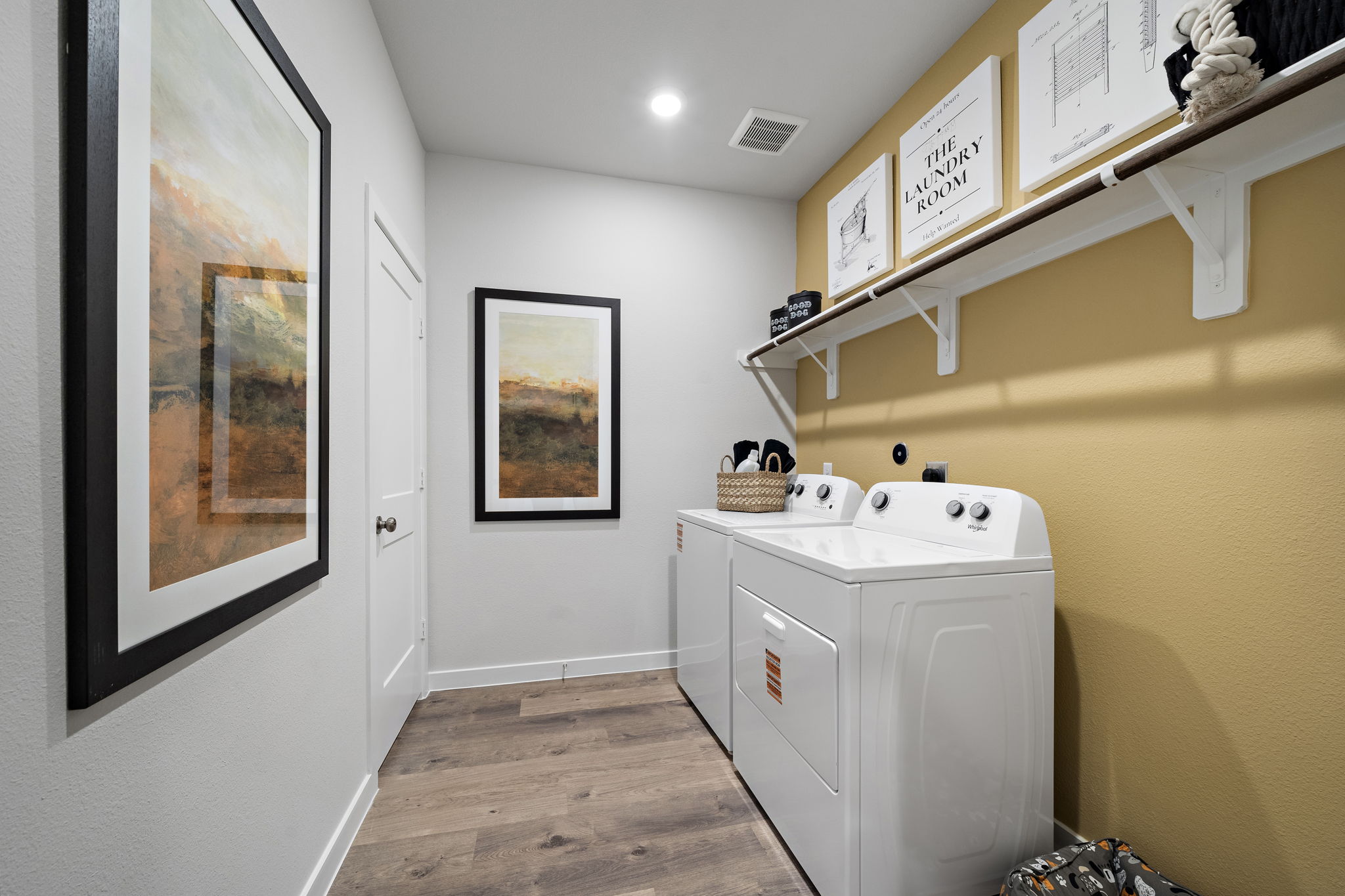 A bathroom with a sink and a washer.