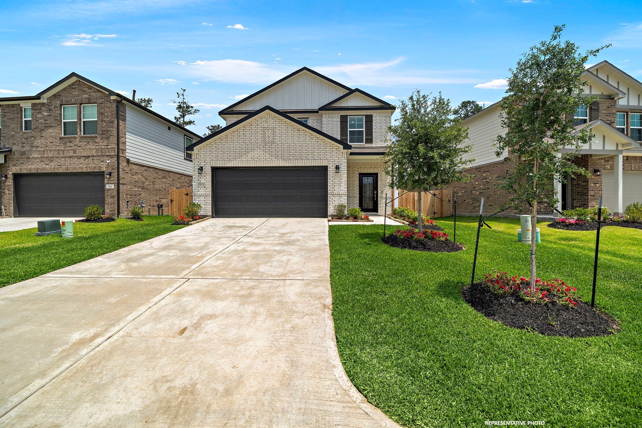 A driveway leading to a house.