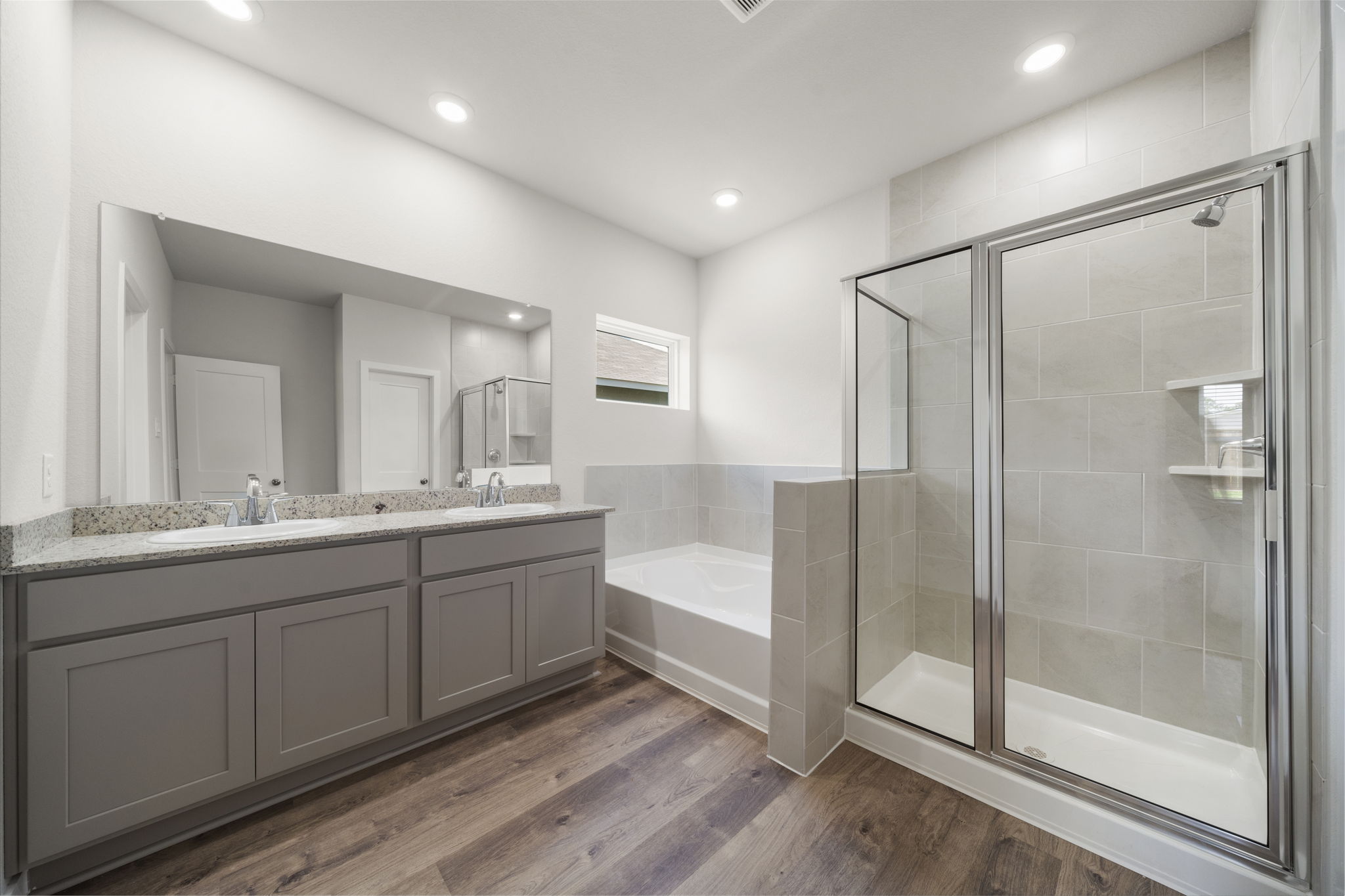A bathroom with a glass shower.