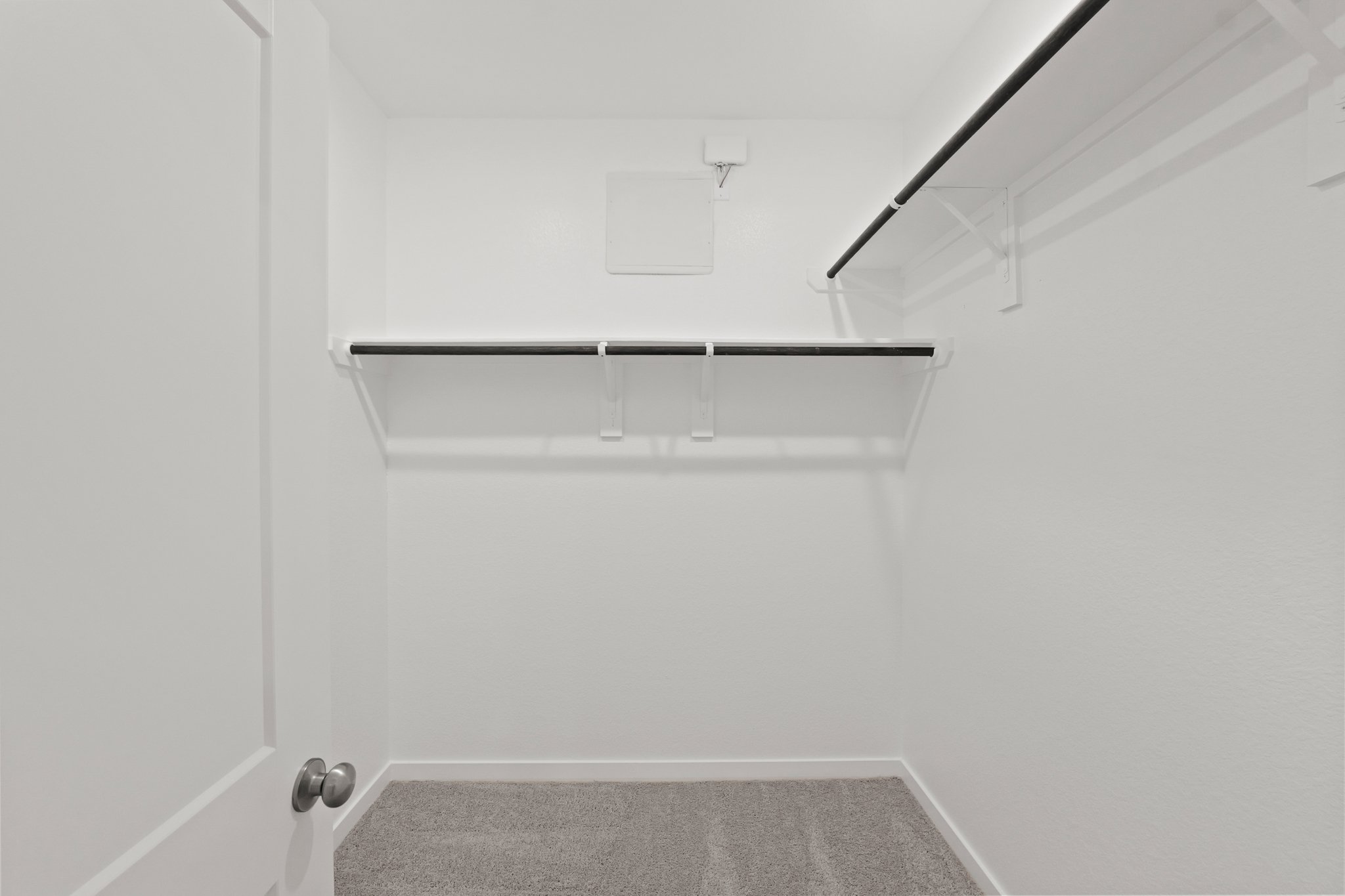 A white room with a white wall.