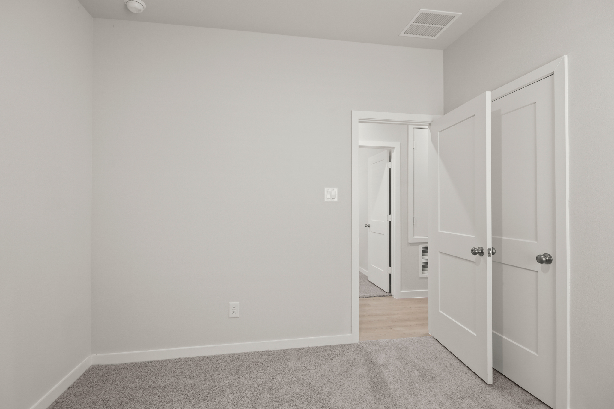 A room with white doors.