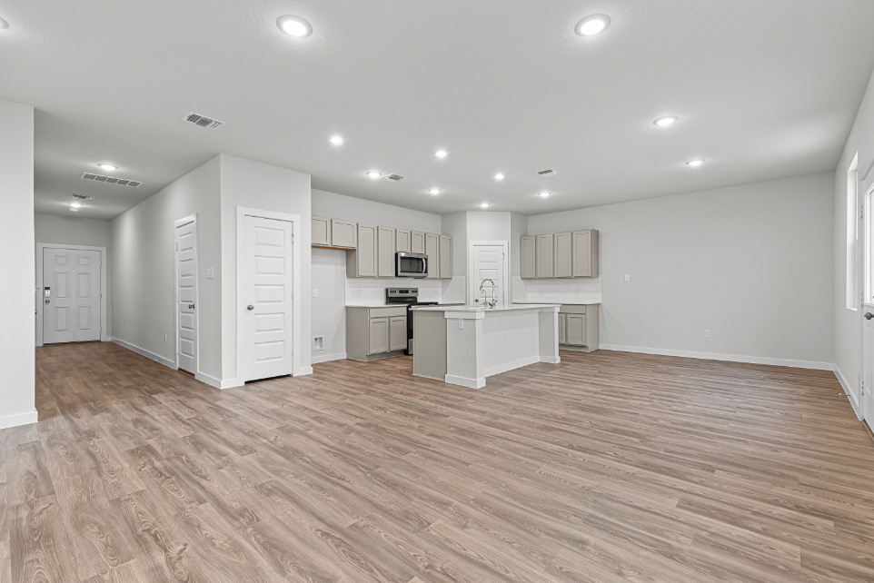 A large kitchen with white cabinets.