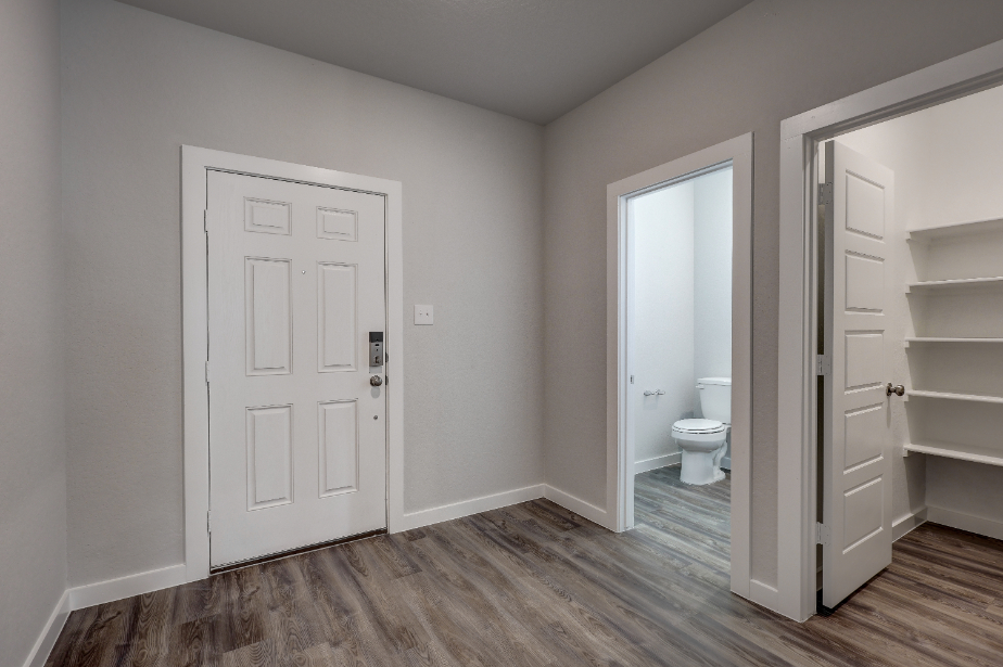 A bathroom with white doors.
