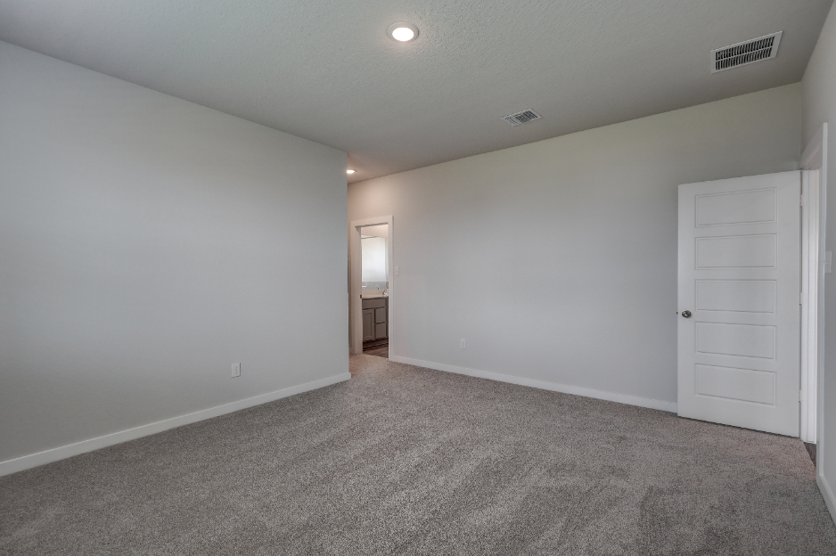 A hallway with white doors.