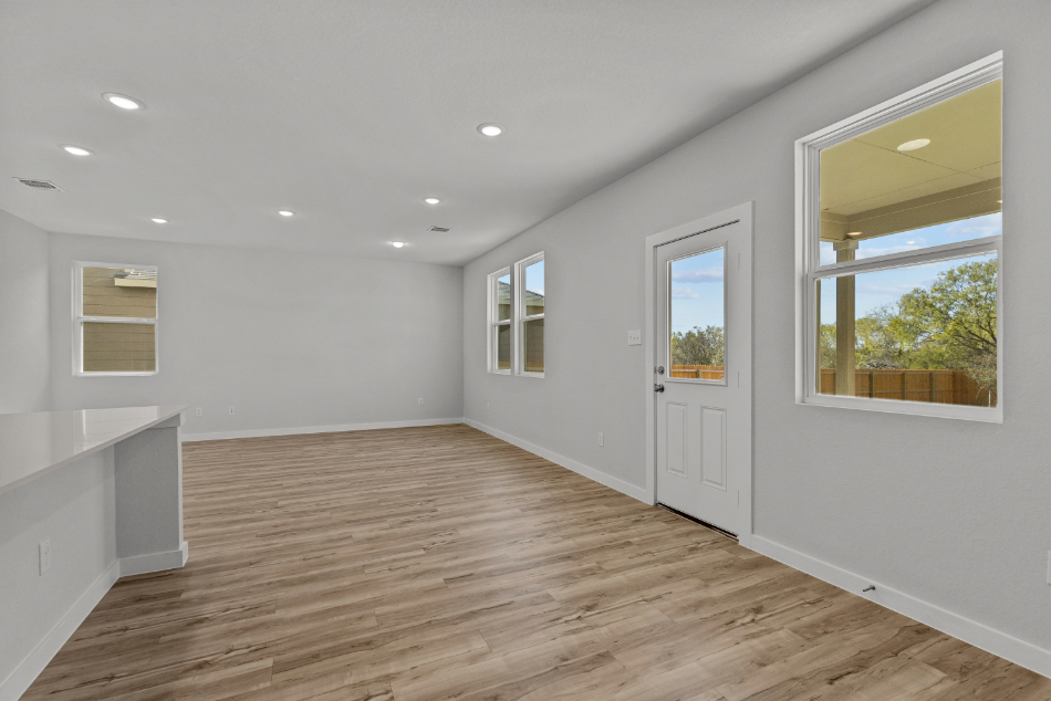 A room with white walls and windows.