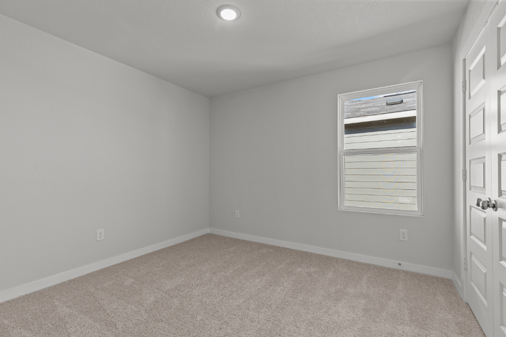 A room with a door and a window.