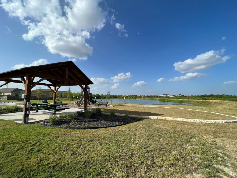 A gazebo on a grassy hill.