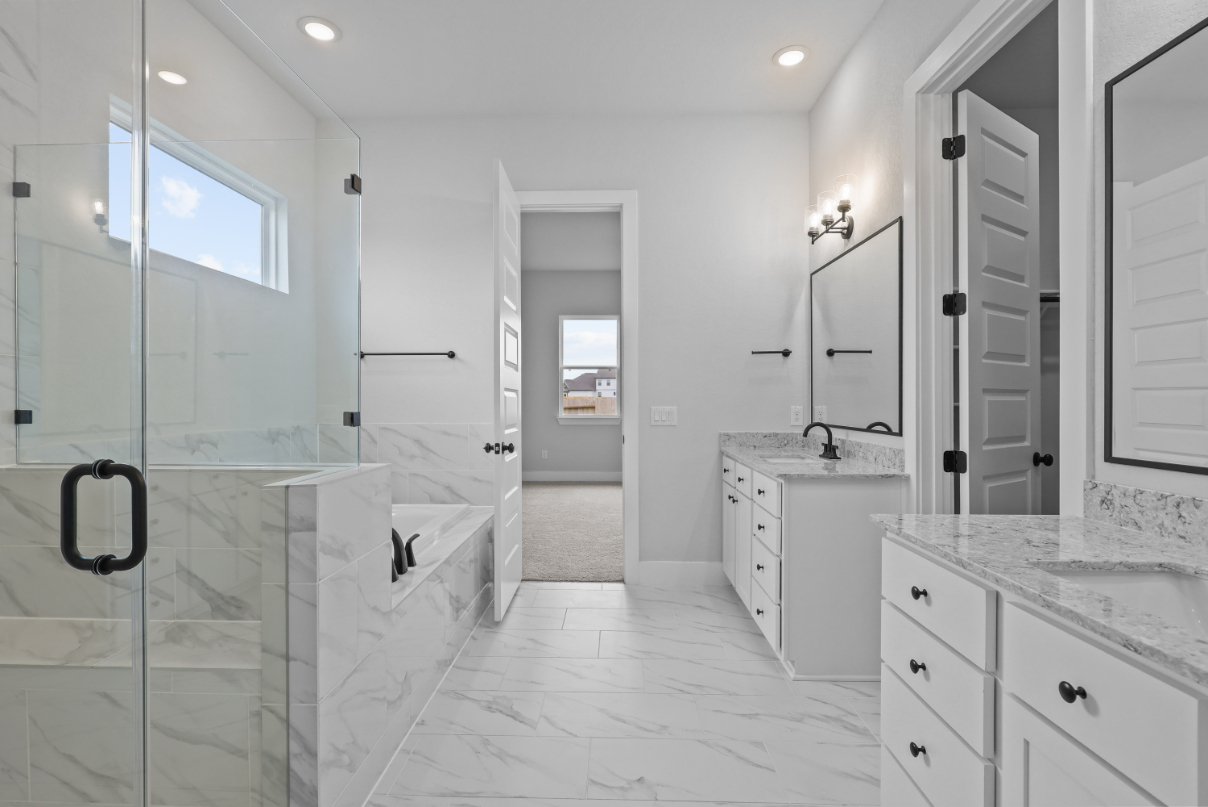 A bathroom with a glass shower.