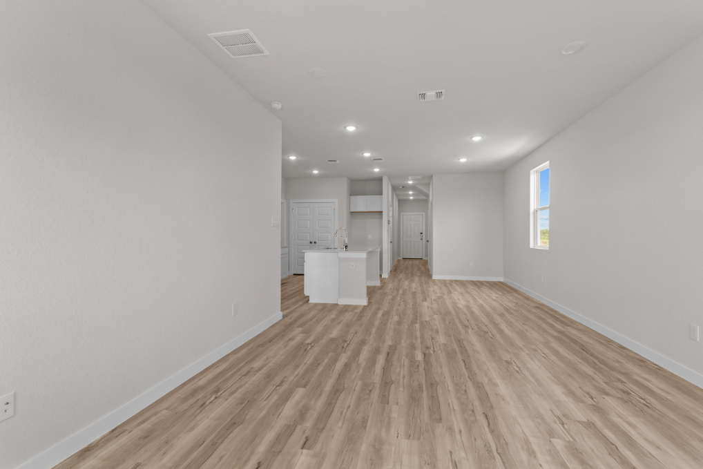 A long hallway with white walls.