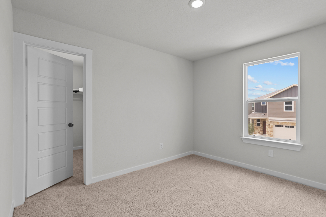 A room with a door and a window.