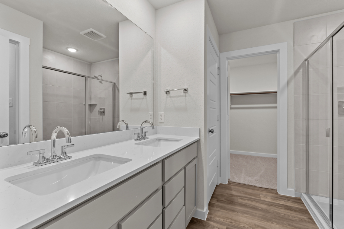 A bathroom with a glass shower.
