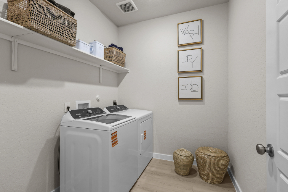 A laundry room with a washer and dryer.