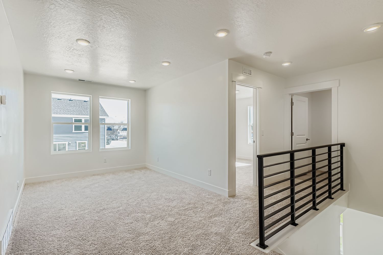 A room with a bed and a table.