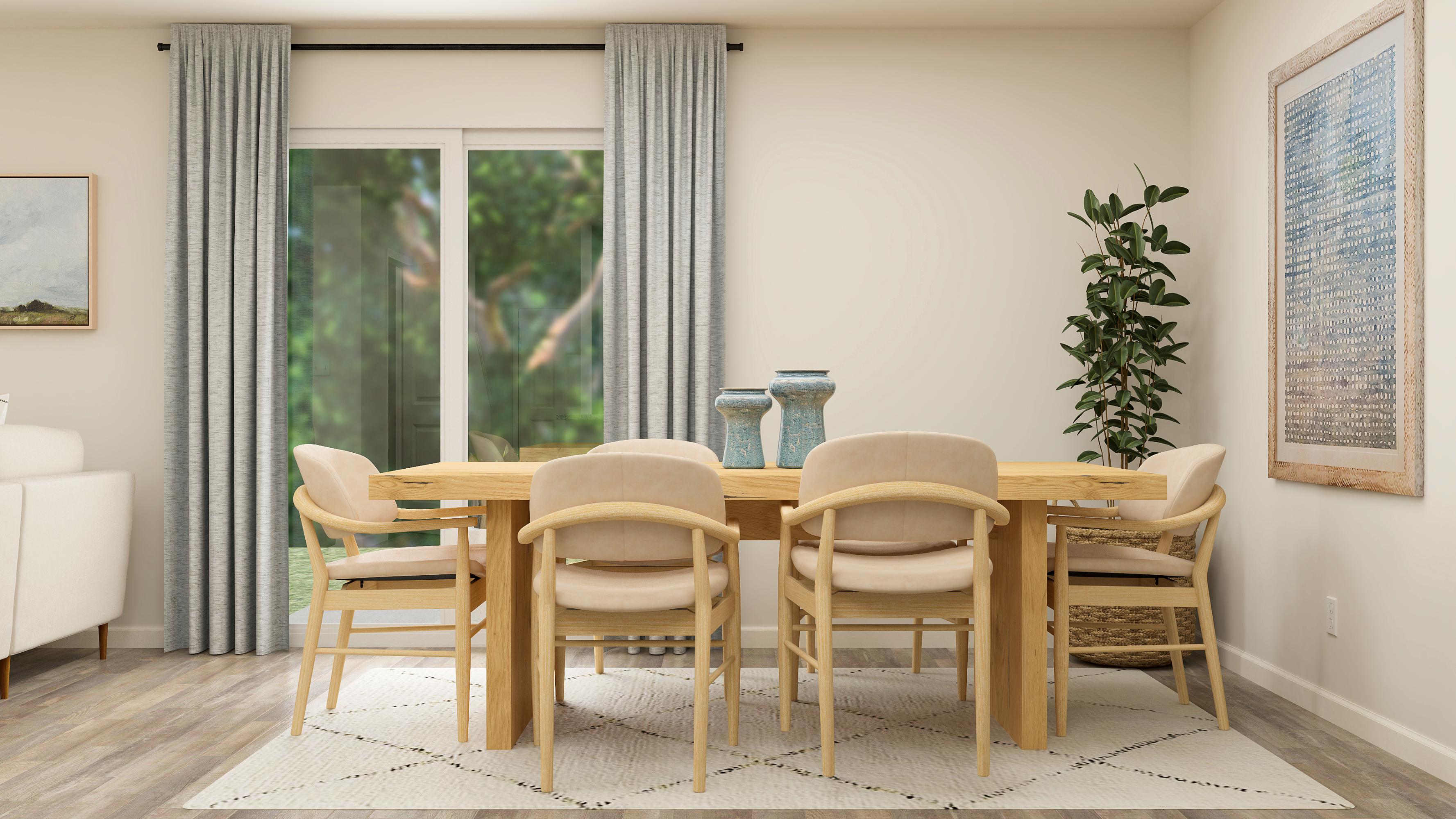 A dining room table with chairs around it.