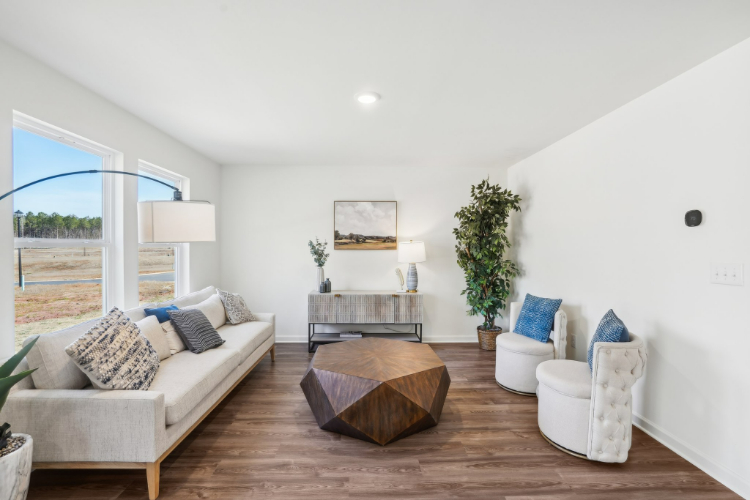 A living room with a large glass door.