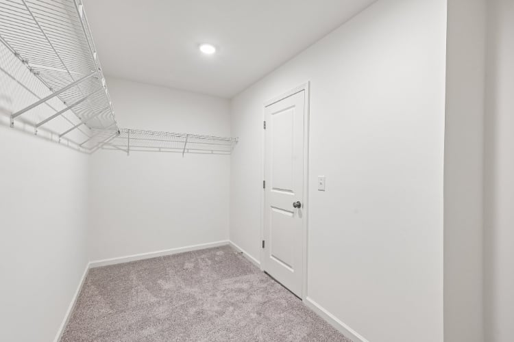 A hallway with white walls.