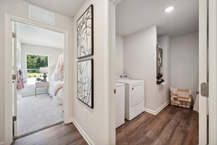 A room with a bed and a desk.