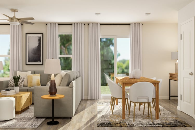 A living room with a table and chairs.