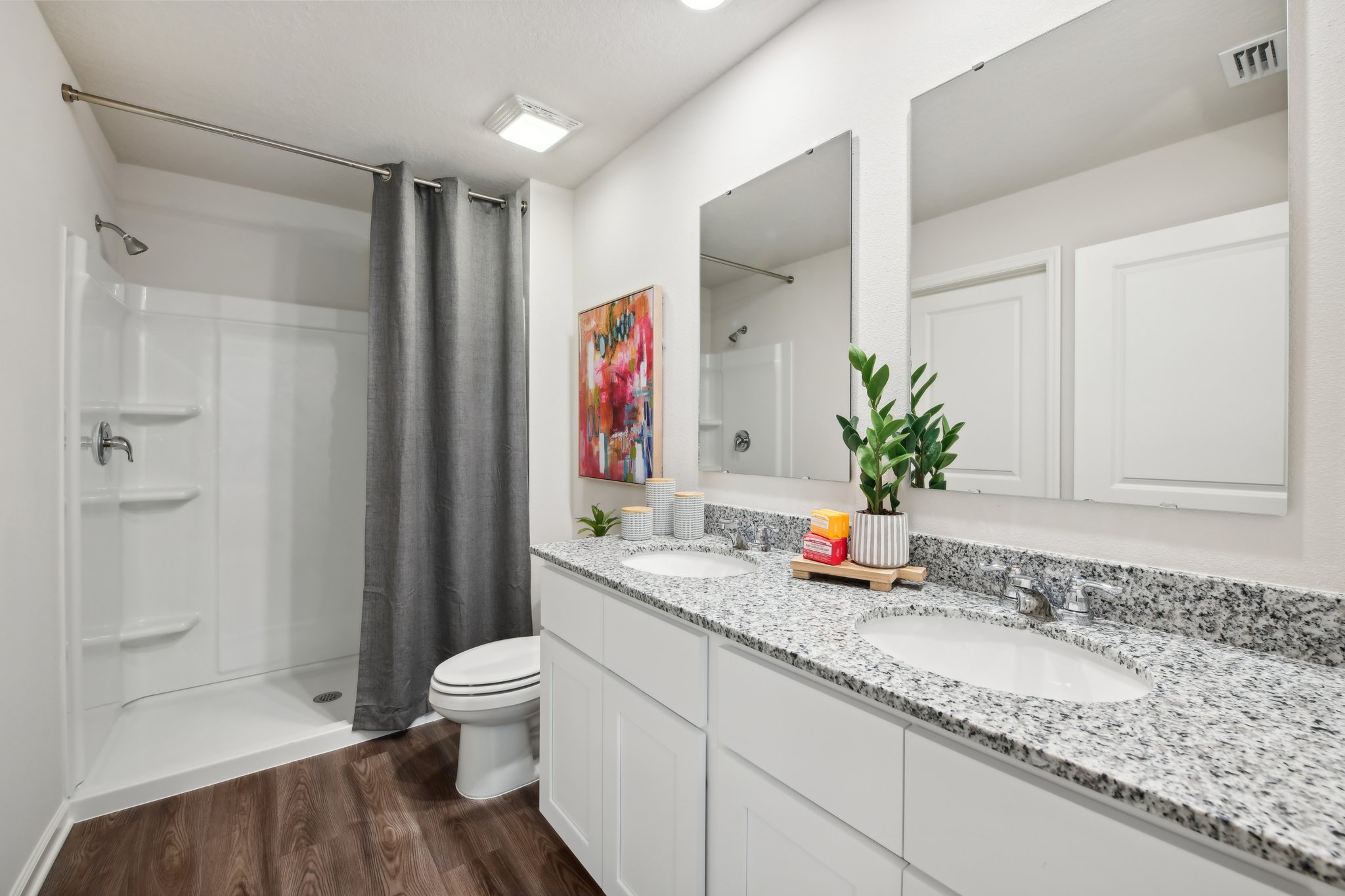 A bathroom with a tub sink and toilet.