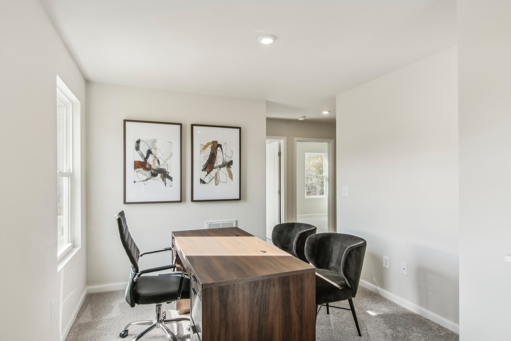 A room with a table and chairs.