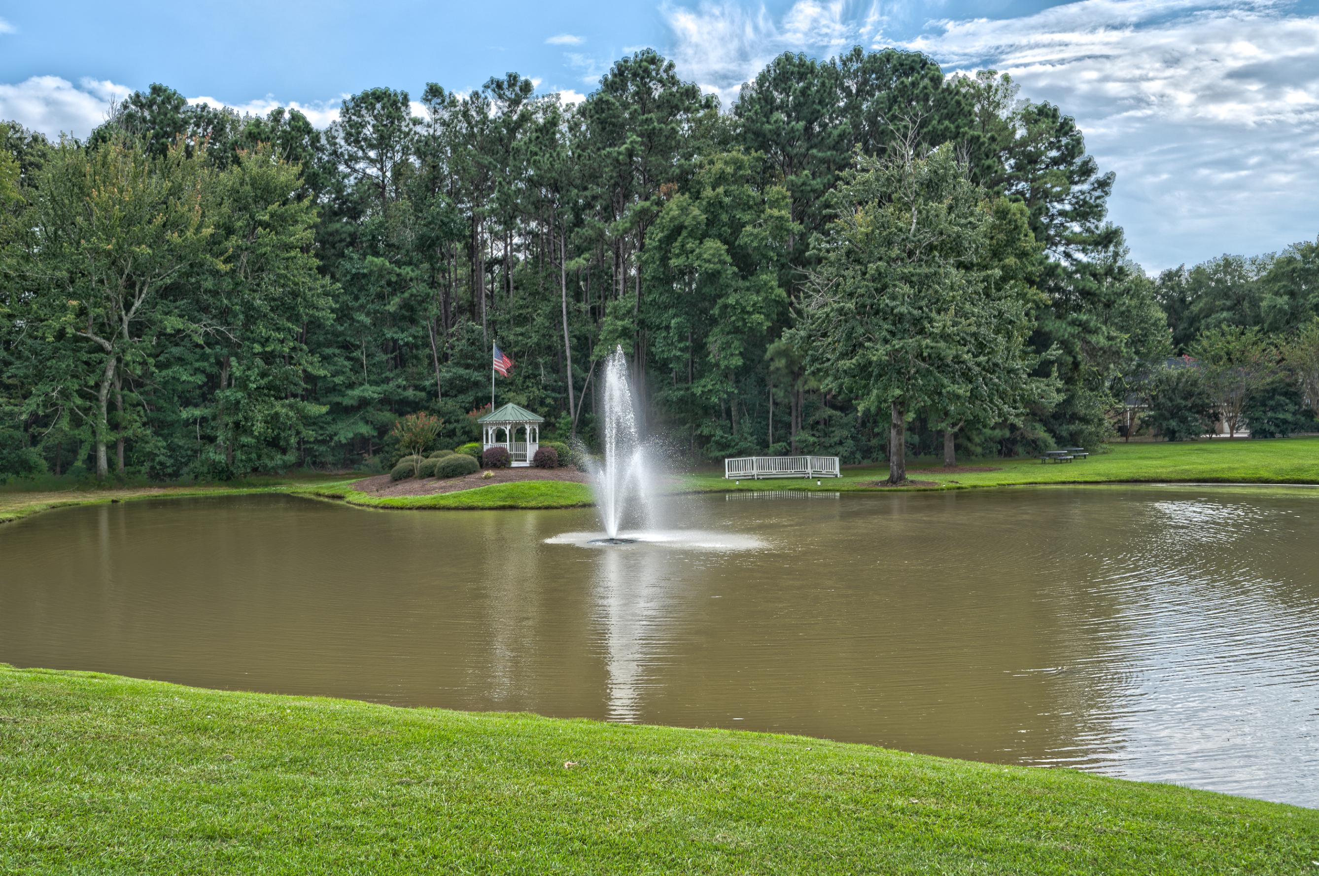 A fountain in a pond.