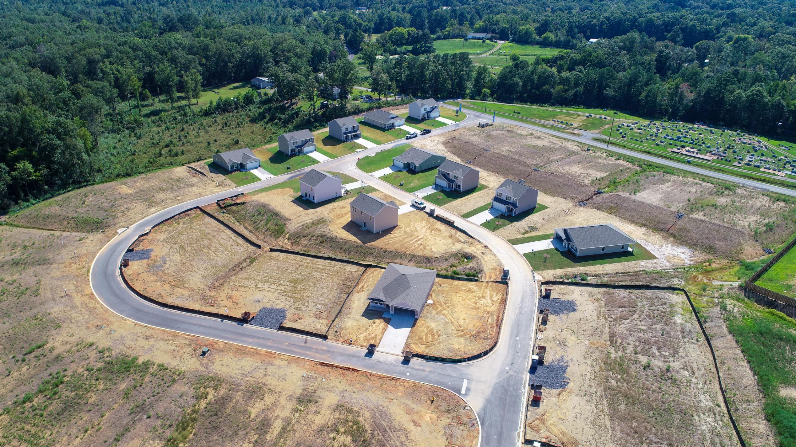 A group of buildings in a field.