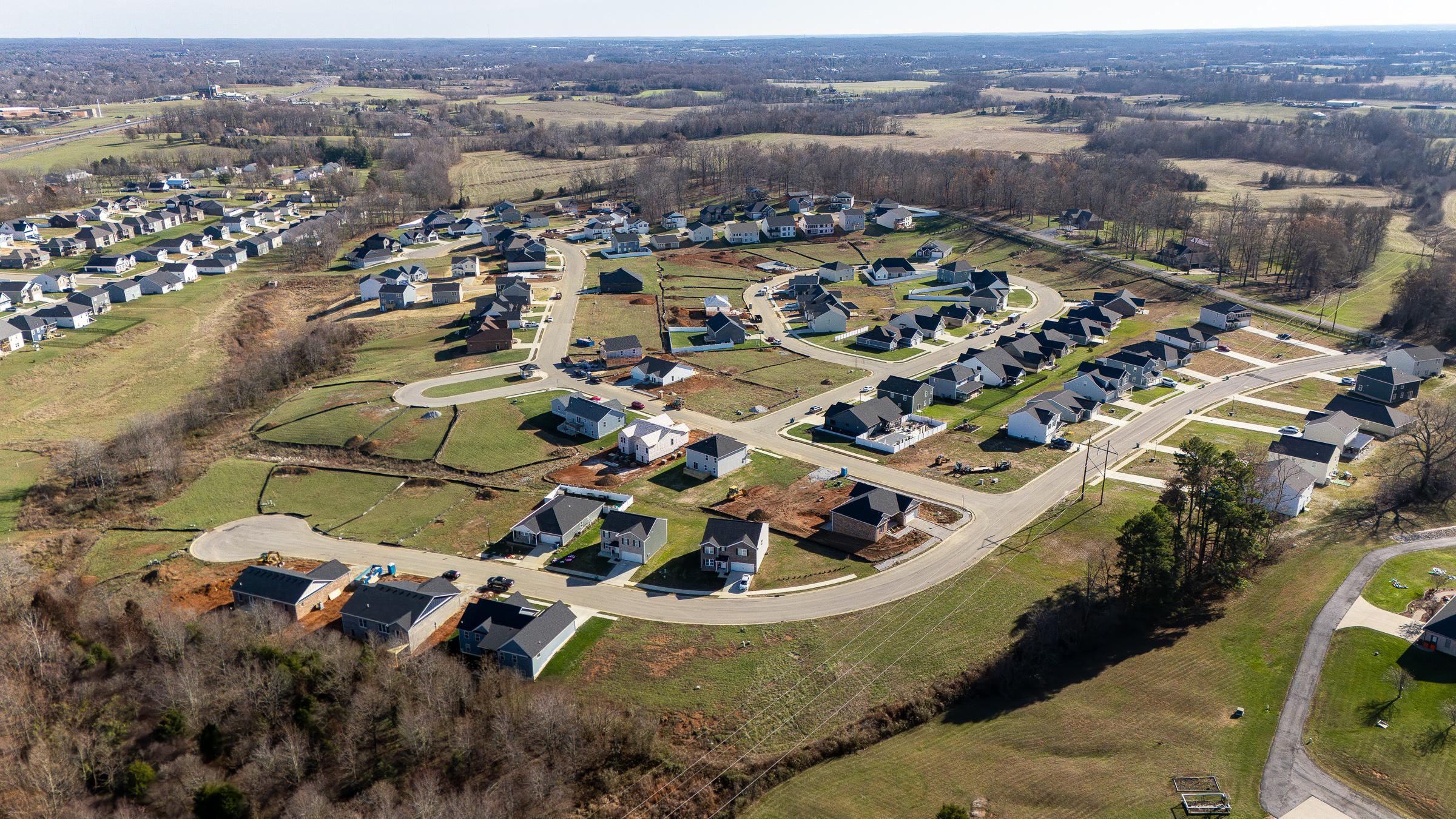 A group of houses in a field.