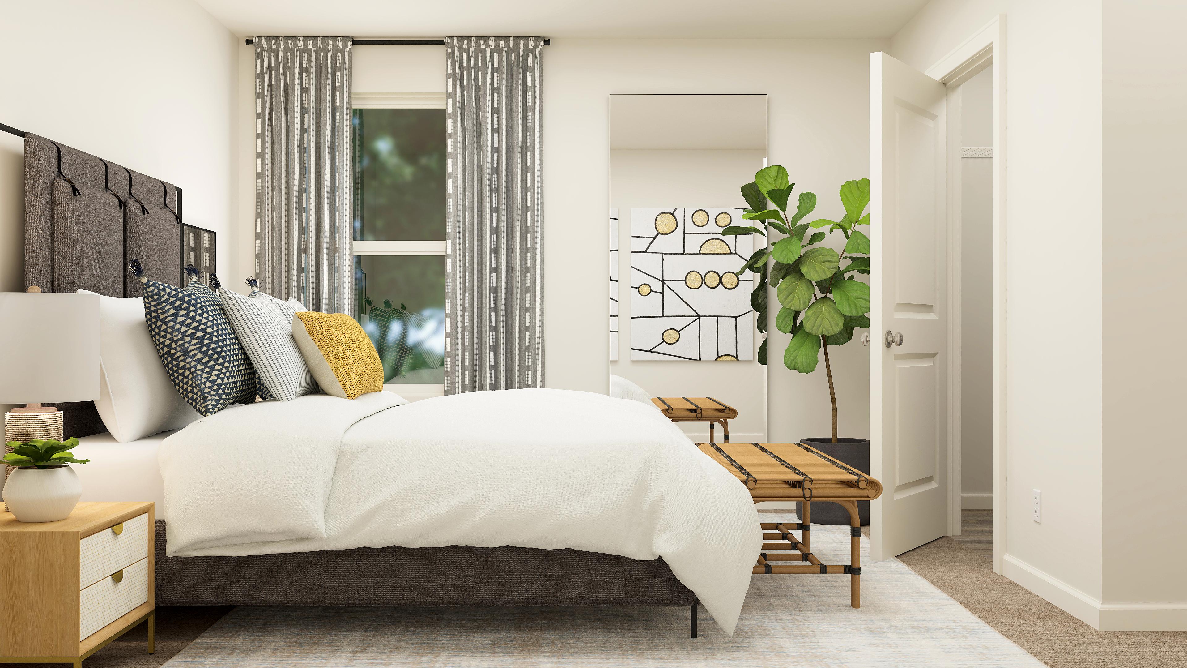 A bedroom with a bed and a table.